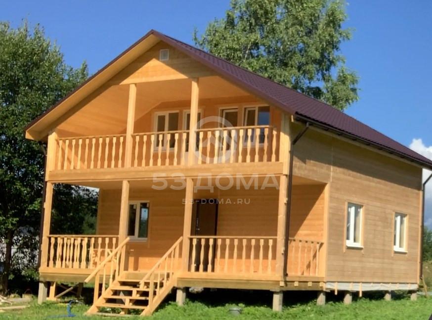Каркасный дом по проекту ДК 066 8×8 м с террасой и балконом, 4 недели